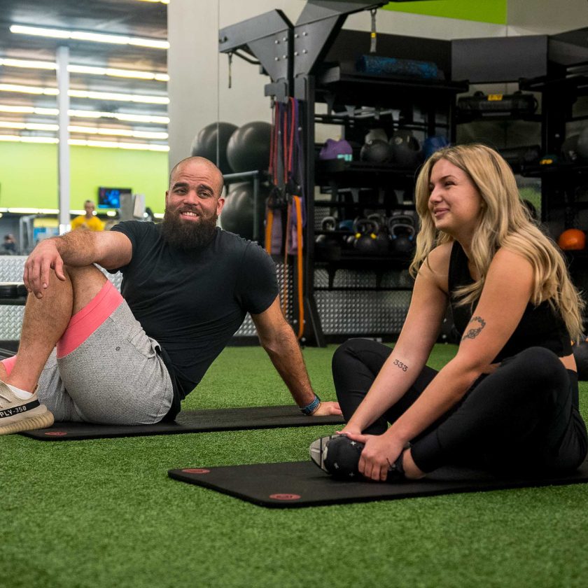 2 gym members stretch after a workout in the core stretch area at a gym near me 10gym in oklahoma