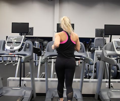 Gym member using treadmill gym in tulsa