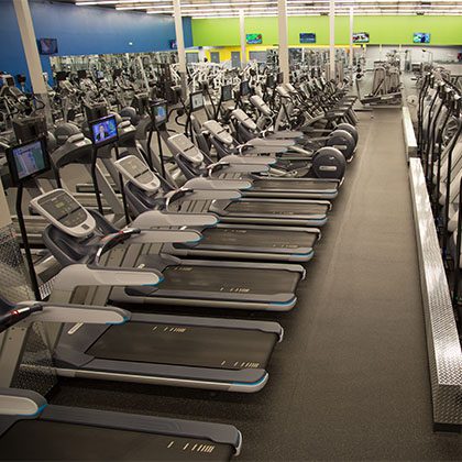 rows of cardio machines ie treadmills in east tulsa gym