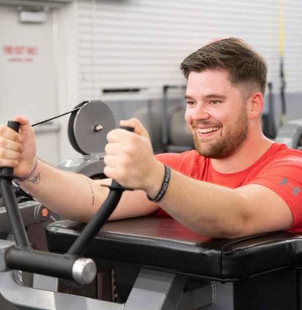 member at gym in tulsa strength training