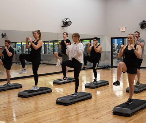 exciting group exercise class with steps