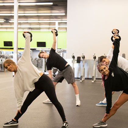 a group training together with kettlebells