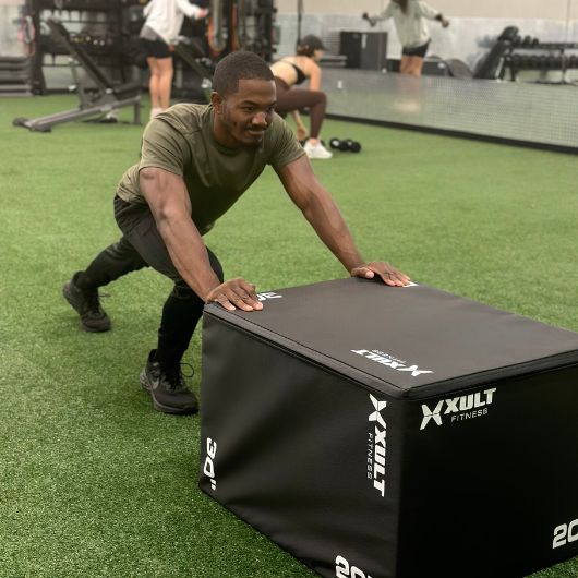a gym member does a functional training exercise at the core and stretch area in south tulsa's 10gym location