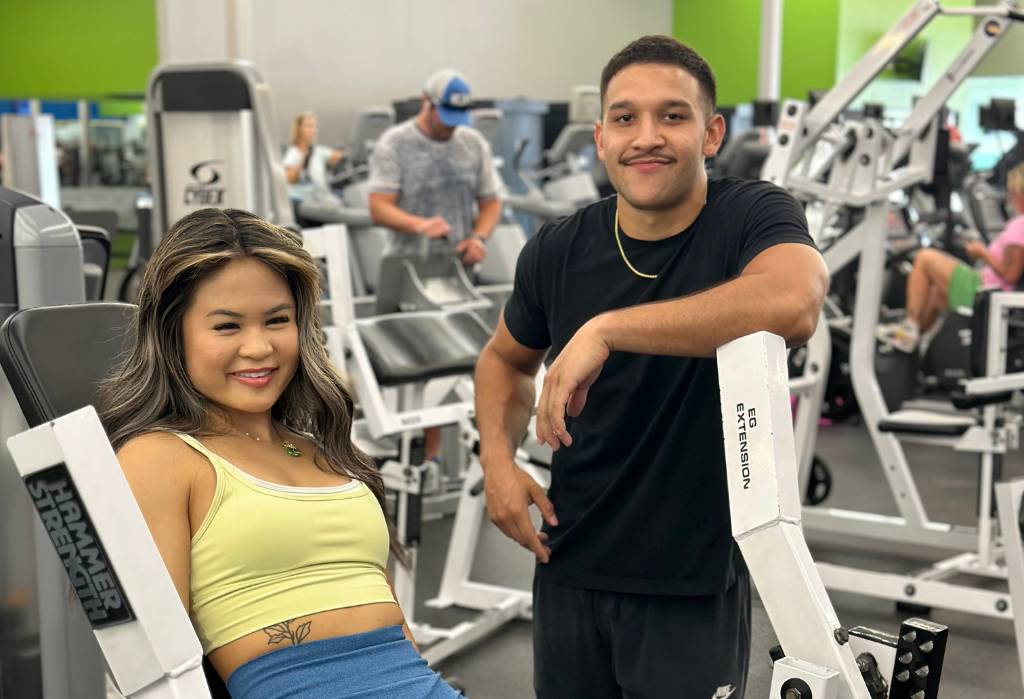 2 gym members hang out between sets at 10gym midwest city in oklahoma