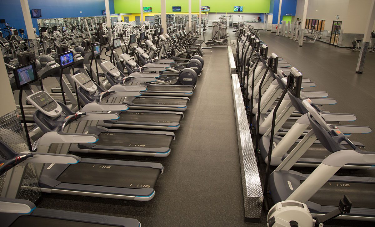 rows of cardio machines ie treadmills