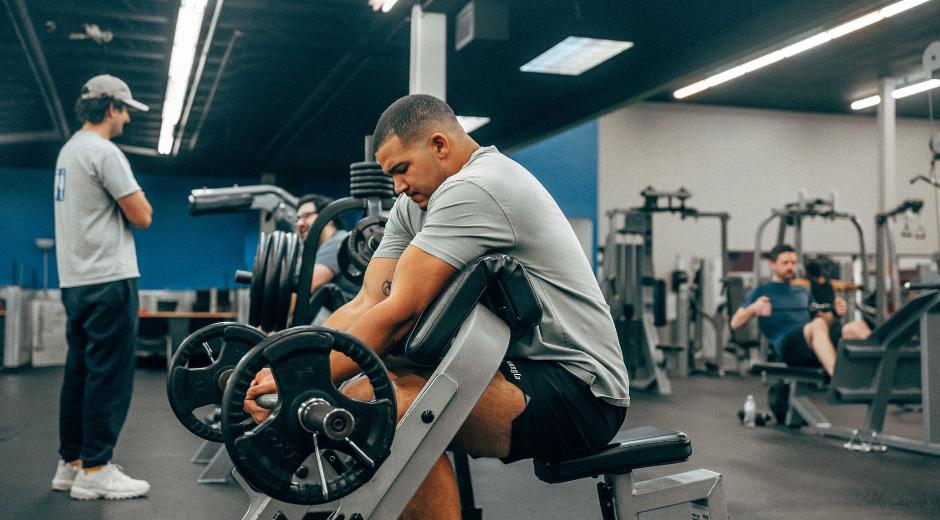 a10GYM north okc member uses freeweights for strength training and muscle building