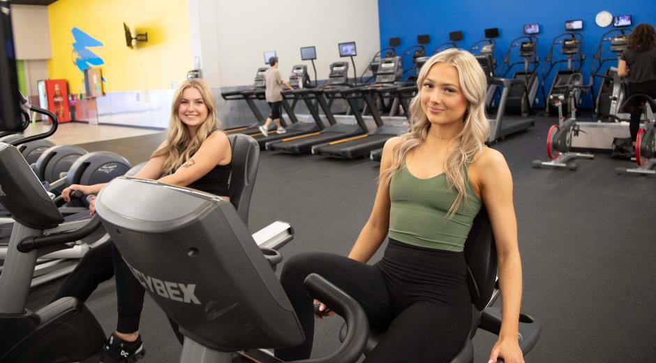 Gym members during a high-energy cycling cardio session at 10GYM Norman OK