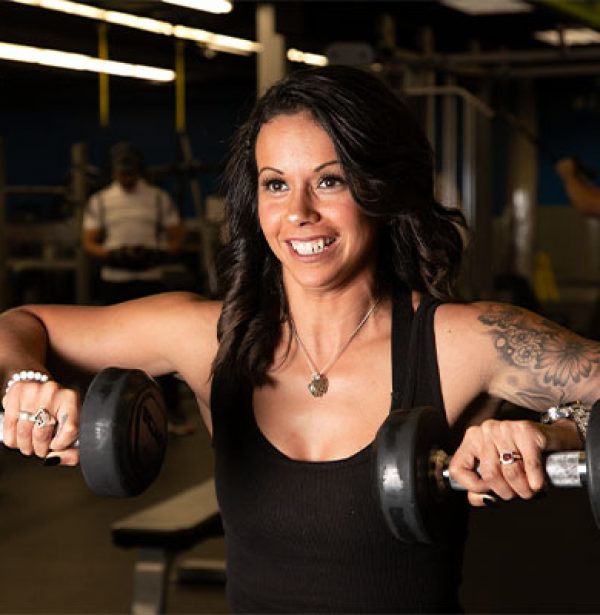 woman using weights during workout to build muscle