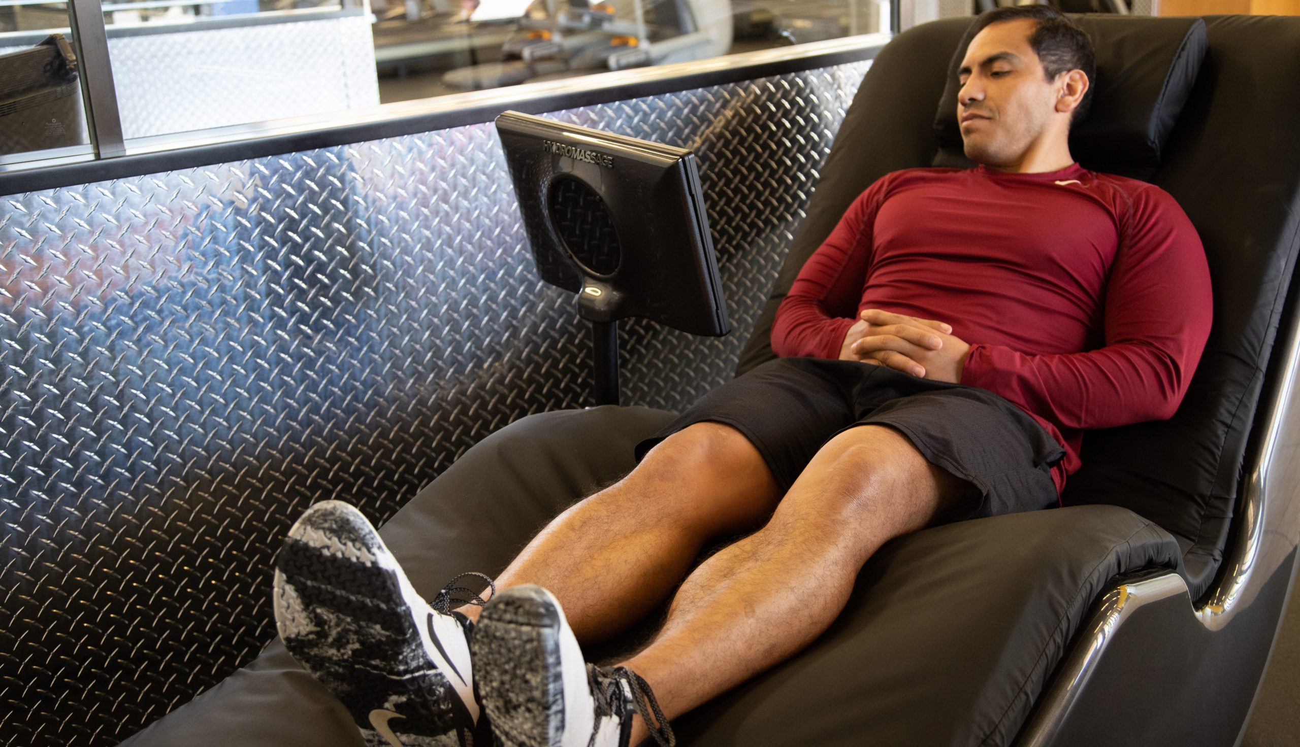 Man using massage chair in gym