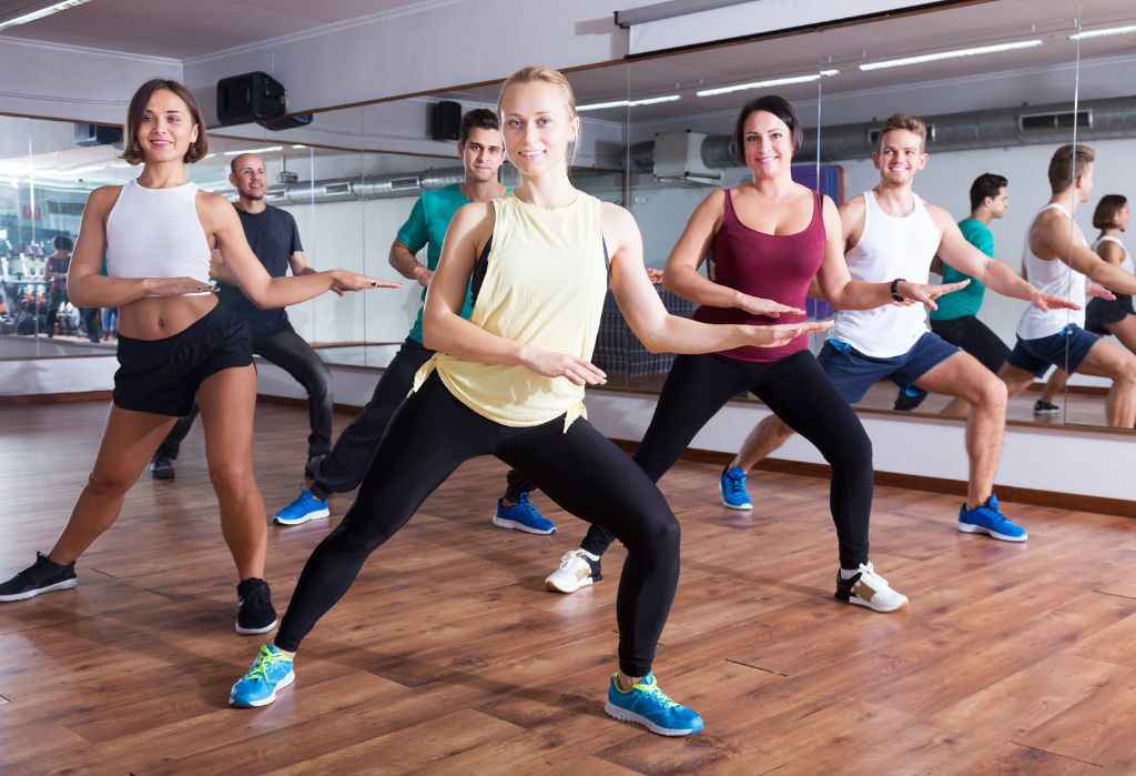 gym members dance during an energizing zumba group fitness class at 10gym in south okc