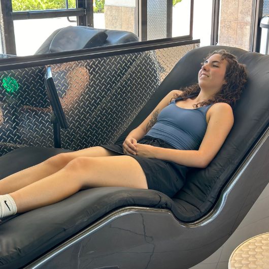 a gym member enjoys a post workout hydromassage recovery session at 10gym in south tulsa