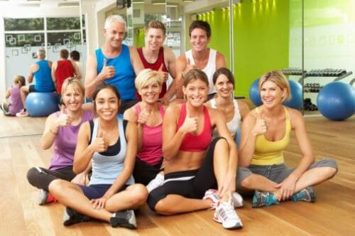 Group of people after exercising at gym.